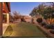 Landscaped backyard with putting green and mountain views at 9887 E Edgestone Dr, Scottsdale, AZ 85255