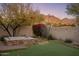 Backyard with hot tub, putting green, and mountain views at 9887 E Edgestone Dr, Scottsdale, AZ 85255