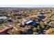 Aerial view of a home with a private pool and expansive desert views at 10400 E Breathless Ave, Gold Canyon, AZ 85118