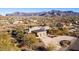 Aerial view of the property highlighting its location, size, and mountain views at 10400 E Breathless Ave, Gold Canyon, AZ 85118