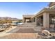 Large backyard with a pool, patio, and stunning mountain views at 10400 E Breathless Ave, Gold Canyon, AZ 85118