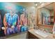 Bathroom with vanity, mirror, and colorful artwork at 10400 E Breathless Ave, Gold Canyon, AZ 85118