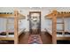 Bunk room with two sets of built-in bunk beds and a small rug at 10400 E Breathless Ave, Gold Canyon, AZ 85118