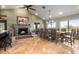 Spacious dining room with a large table, chandelier, and fireplace at 10400 E Breathless Ave, Gold Canyon, AZ 85118