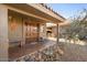 Inviting front porch with ornate wooden doors at 10400 E Breathless Ave, Gold Canyon, AZ 85118