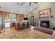 Kitchen with dark wood cabinets, a large island, and fireplace at 10400 E Breathless Ave, Gold Canyon, AZ 85118