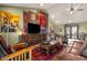 Living room with leather couches, wood accents, and large TV at 10400 E Breathless Ave, Gold Canyon, AZ 85118