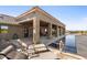 Luxury pool with lounge chairs and covered patio at 10400 E Breathless Ave, Gold Canyon, AZ 85118