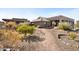 Landscaped yard with gravel pathway and citrus trees at 10400 E Breathless Ave, Gold Canyon, AZ 85118