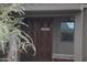 Bunkhouse entrance with double wooden doors and a rustic bench at 10400 E Breathless Ave, Gold Canyon, AZ 85118