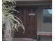 Bunkhouse entrance with carved wooden doors and a small window at 10400 E Breathless Ave, Gold Canyon, AZ 85118