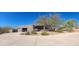 One-story home with stucco exterior and a circular driveway at 10400 E Breathless Ave, Gold Canyon, AZ 85118