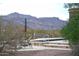 Relaxing pool area with mountain views and lounge chairs at 10400 E Breathless Ave, Gold Canyon, AZ 85118