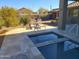 Private spa with stone tile decking and lounge chairs at 10400 E Breathless Ave, Gold Canyon, AZ 85118