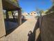 Backyard view showing covered patio and block wall at 11410 W Cocopah St, Avondale, AZ 85323