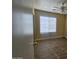 Simple bedroom with wood-look flooring and a window at 11410 W Cocopah St, Avondale, AZ 85323