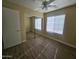 Bedroom with double closets and wood-look flooring at 11410 W Cocopah St, Avondale, AZ 85323