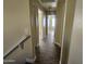 Hallway with wood-look floors and access to bedrooms at 11410 W Cocopah St, Avondale, AZ 85323