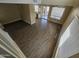 Bright living room with wood-look floors and view into kitchen at 11410 W Cocopah St, Avondale, AZ 85323