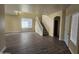 Spacious living room with hardwood floors and staircase at 11410 W Cocopah St, Avondale, AZ 85323