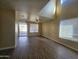 Living room with hardwood floors, access to backyard, and high ceiling at 11410 W Cocopah St, Avondale, AZ 85323