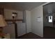 Laundry room with washer, dryer, and overhead cabinets at 120 N Val Vista Dr # 202, Mesa, AZ 85213