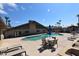 Community pool with lounge chairs and tables at 120 N Val Vista Dr # 202, Mesa, AZ 85213