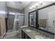 Bathroom with double sinks, granite countertop, and bathtub at 12312 E Poinsettia Dr, Scottsdale, AZ 85259