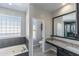 Main bathroom with soaking tub and double vanity at 12312 E Poinsettia Dr, Scottsdale, AZ 85259