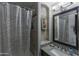 Bathroom with granite vanity, shower, and mirror at 12312 E Poinsettia Dr, Scottsdale, AZ 85259