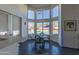 Kitchen breakfast nook with a glass table and stunning pool views at 12312 E Poinsettia Dr, Scottsdale, AZ 85259