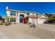 Two-story house with desert landscaping and a three-car garage at 12312 E Poinsettia Dr, Scottsdale, AZ 85259