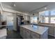 Modern kitchen with large island, stainless steel appliances, and ample counter space at 12312 E Poinsettia Dr, Scottsdale, AZ 85259