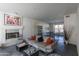 Living room with fireplace, ping pong table, and modern decor at 12312 E Poinsettia Dr, Scottsdale, AZ 85259