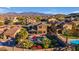 Aerial view of a beautiful home with a pool and mountain views at 13428 S 186Th Ave, Goodyear, AZ 85338