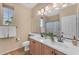 Bathroom with double vanity and a shower/tub combo at 13428 S 186Th Ave, Goodyear, AZ 85338