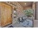 Inviting front porch with stone and wood details at 13428 S 186Th Ave, Goodyear, AZ 85338