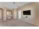 Upstairs loft area with built-in desk and neutral carpeting at 13428 S 186Th Ave, Goodyear, AZ 85338