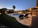 Relaxing pool and patio area at night at 13428 S 186Th Ave, Goodyear, AZ 85338