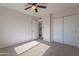 Bright bedroom with ceiling fan and ample closet space at 1348 E Chilton Dr, Tempe, AZ 85283