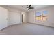 Well-lit bedroom featuring carpet, a large closet and window at 1348 E Chilton Dr, Tempe, AZ 85283