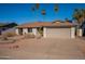 Single-story home with a two-car garage and desert landscaping at 1348 E Chilton Dr, Tempe, AZ 85283