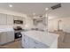 Modern kitchen with gray cabinets, quartz countertops, and stainless steel appliances at 1348 E Chilton Dr, Tempe, AZ 85283