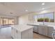 Modern kitchen with gray cabinets, white island and quartz countertops at 1348 E Chilton Dr, Tempe, AZ 85283