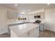 Modern kitchen with gray cabinets and a large kitchen island at 1348 E Chilton Dr, Tempe, AZ 85283