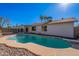 Relaxing kidney-shaped pool with diving board in a sunny backyard at 1348 E Chilton Dr, Tempe, AZ 85283