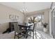 Bright dining area with a charming chandelier and view of the backyard at 14137 W Via Manana --, Sun City West, AZ 85375