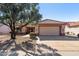 Tan house with tile roof, double garage, and drought-tolerant landscaping at 14137 W Via Manana --, Sun City West, AZ 85375