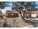 Tan house with a tile roof, double garage, and rock pathway at 14137 W Via Manana --, Sun City West, AZ 85375