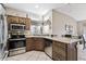 Well-equipped kitchen featuring stainless steel appliances and ample cabinet space at 14137 W Via Manana --, Sun City West, AZ 85375